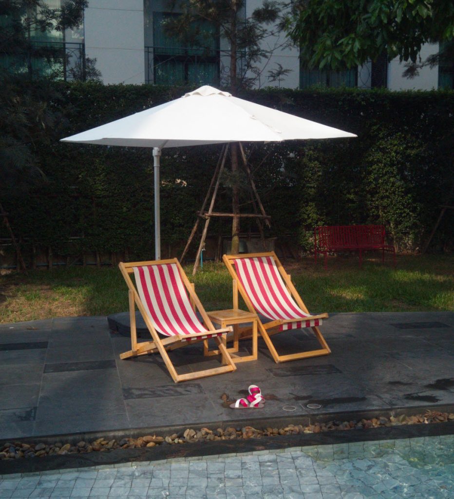 Sundbeds and parasol poolside at Best Western Plus Nexen Pattaya 