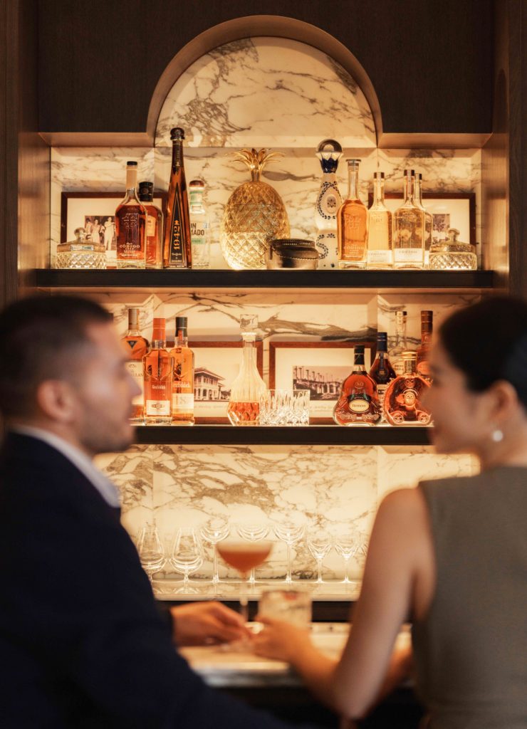 Guests at The Pineapple Room bar