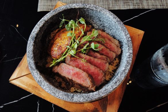 Hot stone bowl fried rice topped with F1 wagyu steak and foie gras