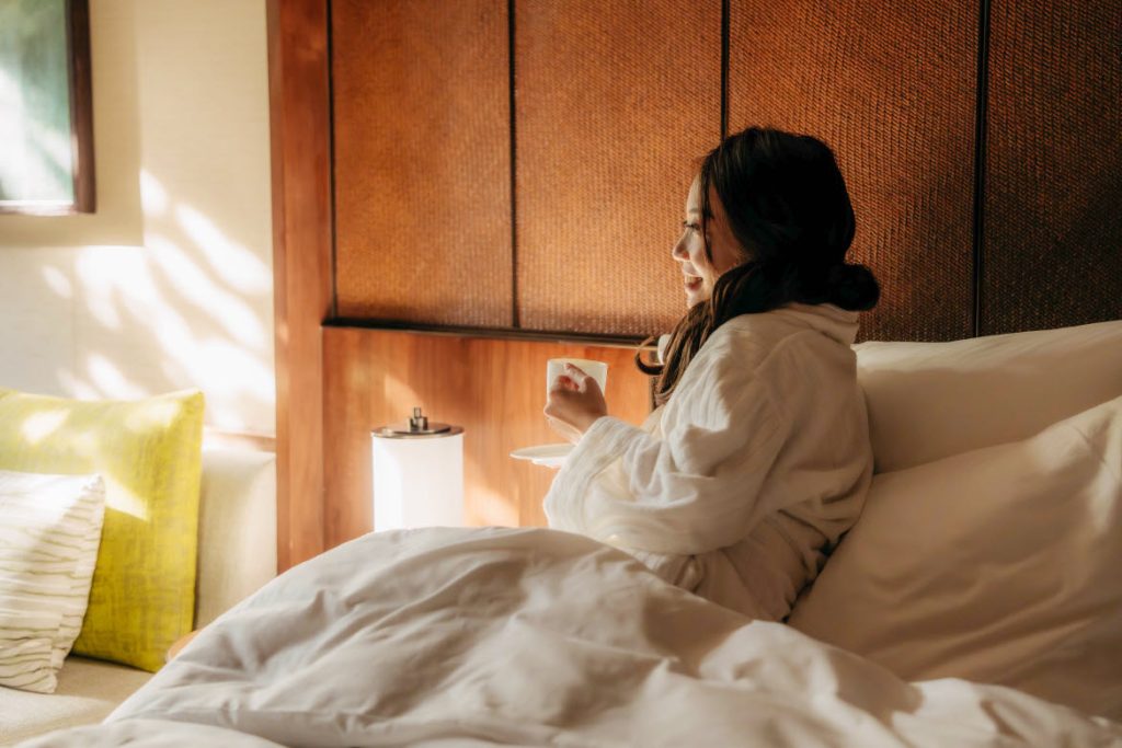 Grand Hyatt Singapore guest in bed