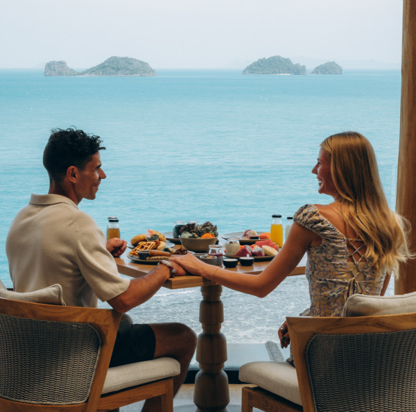 Couple having breakfast at Aow Tai restaurant with panorama seaview