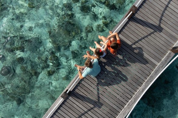 Family on bridge at Sheraton Maldives Full Moon Resort & Spa