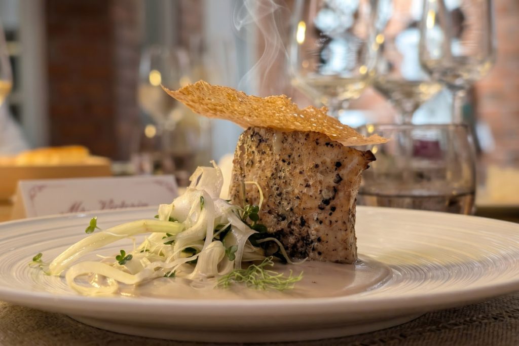 Caravela fish confit plantain puree prawn coral tuile
